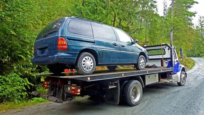 Edmonton flatbed towing a cargo van
