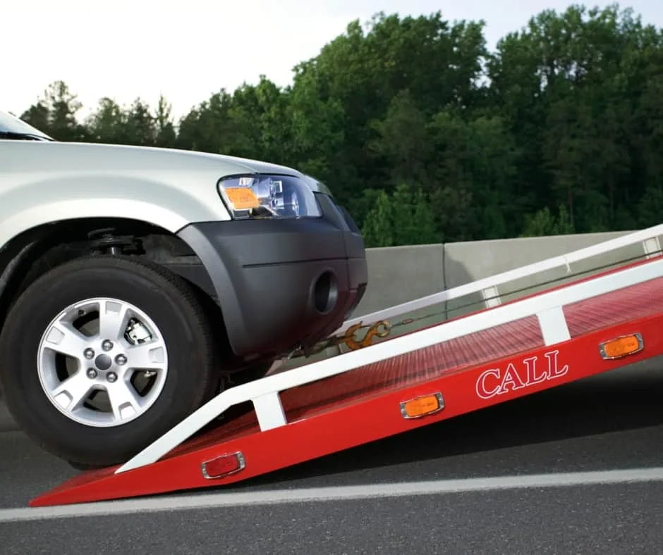 Edmonton tow truck loading a vehicle on a residential street